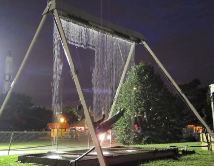 A waterfall swing set that somehow always stays dry.