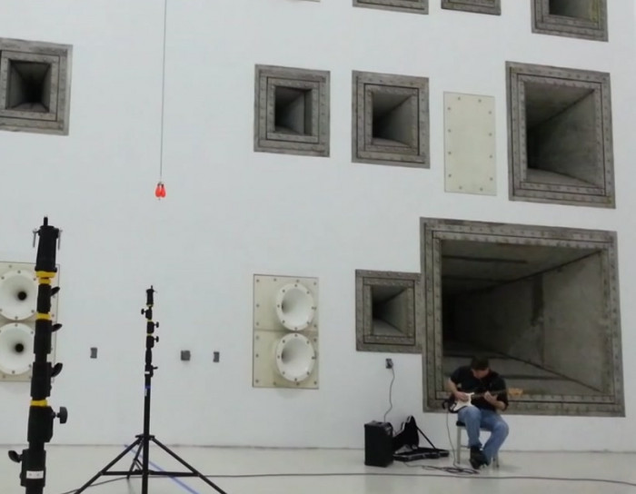 Playing guitar in a NASA space chamber.