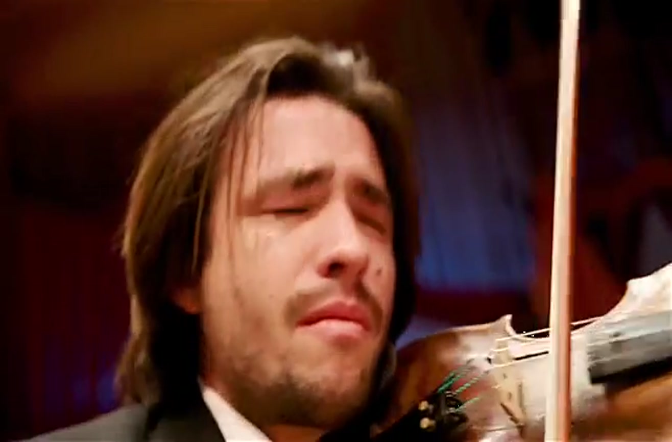Classical orchestra performs while eating the worlds hottest chili peppers.