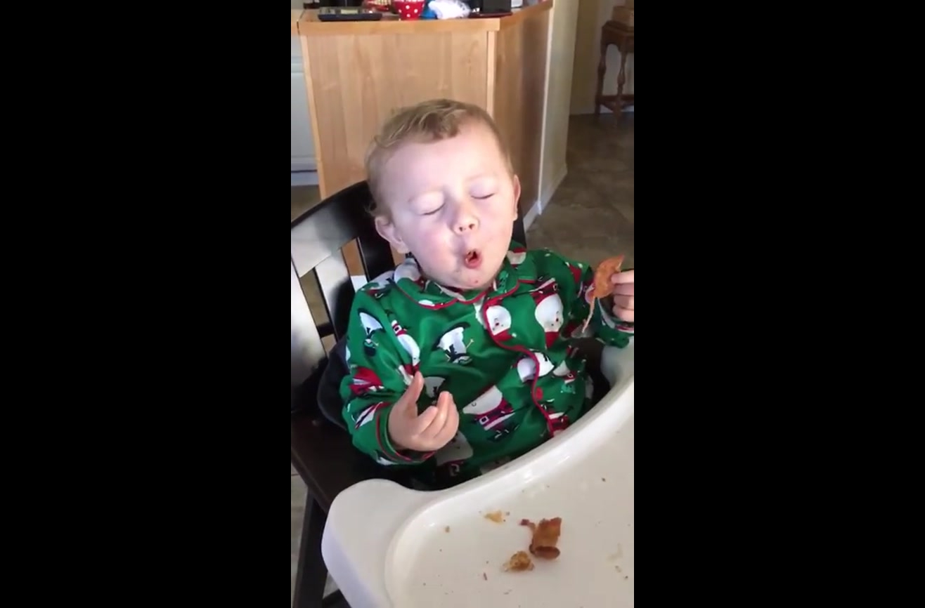 Baby tries bacon for the first time and loses his mind.