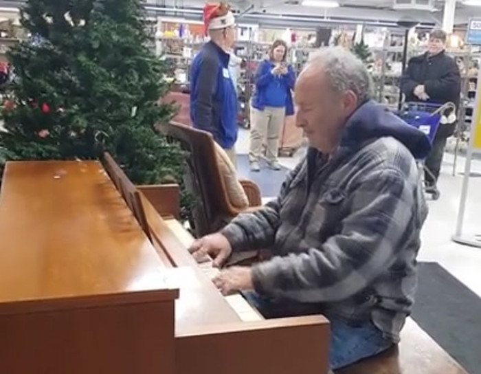 Man walks into Goodwill store and starts playing the piano.