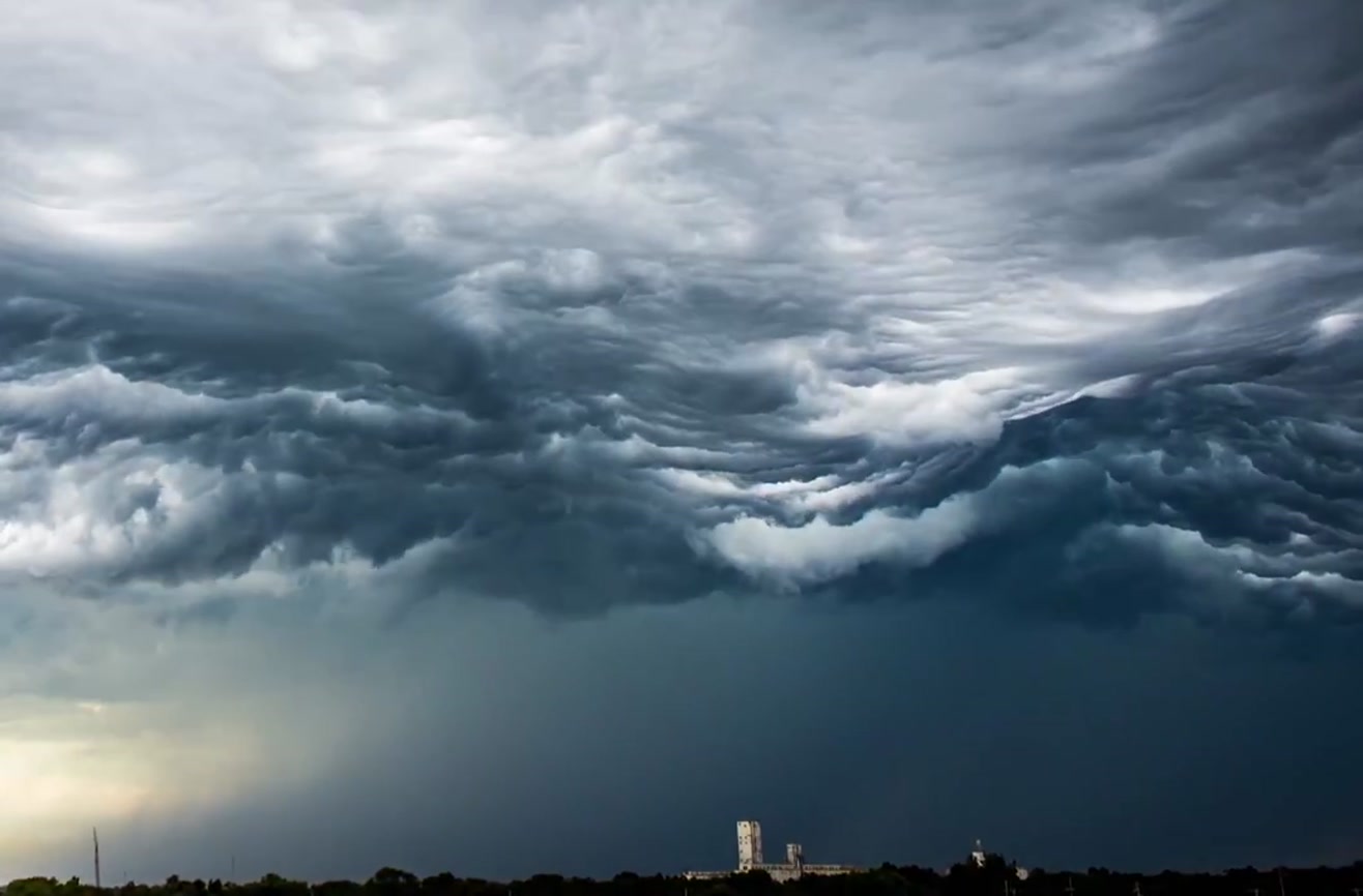 Timelapse of clouds looks like rolling ocean waves.