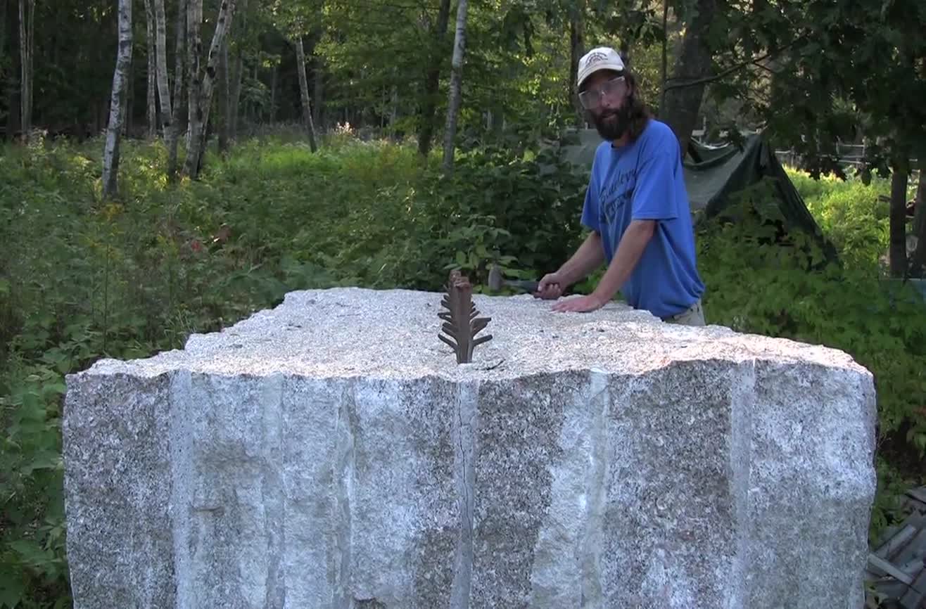 Cutting a 26,000 lb granite block by hammer and chisel.