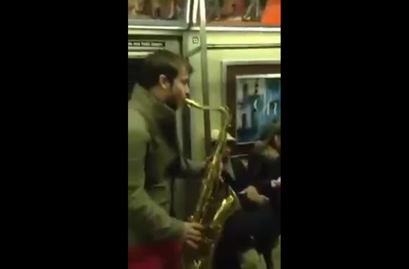 Saxophone battle in NYC subway.