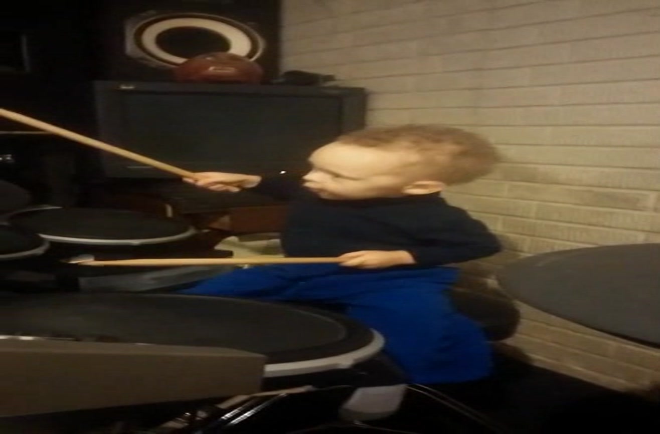 Twoyearold rocks out to the Foo Fighters on drums.