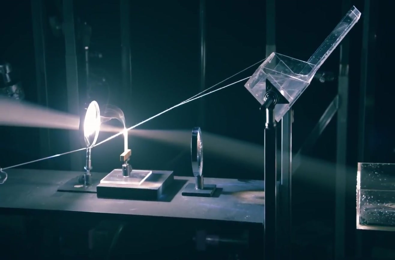 A Rube Goldberg machine powered by light and magnifying glasses.