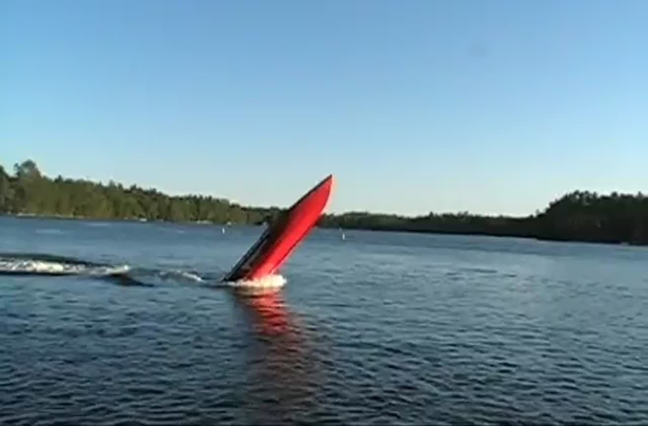 Guy doing boat wheelies.