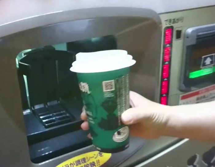 Japanese coffee vending machine shows its working process live on an