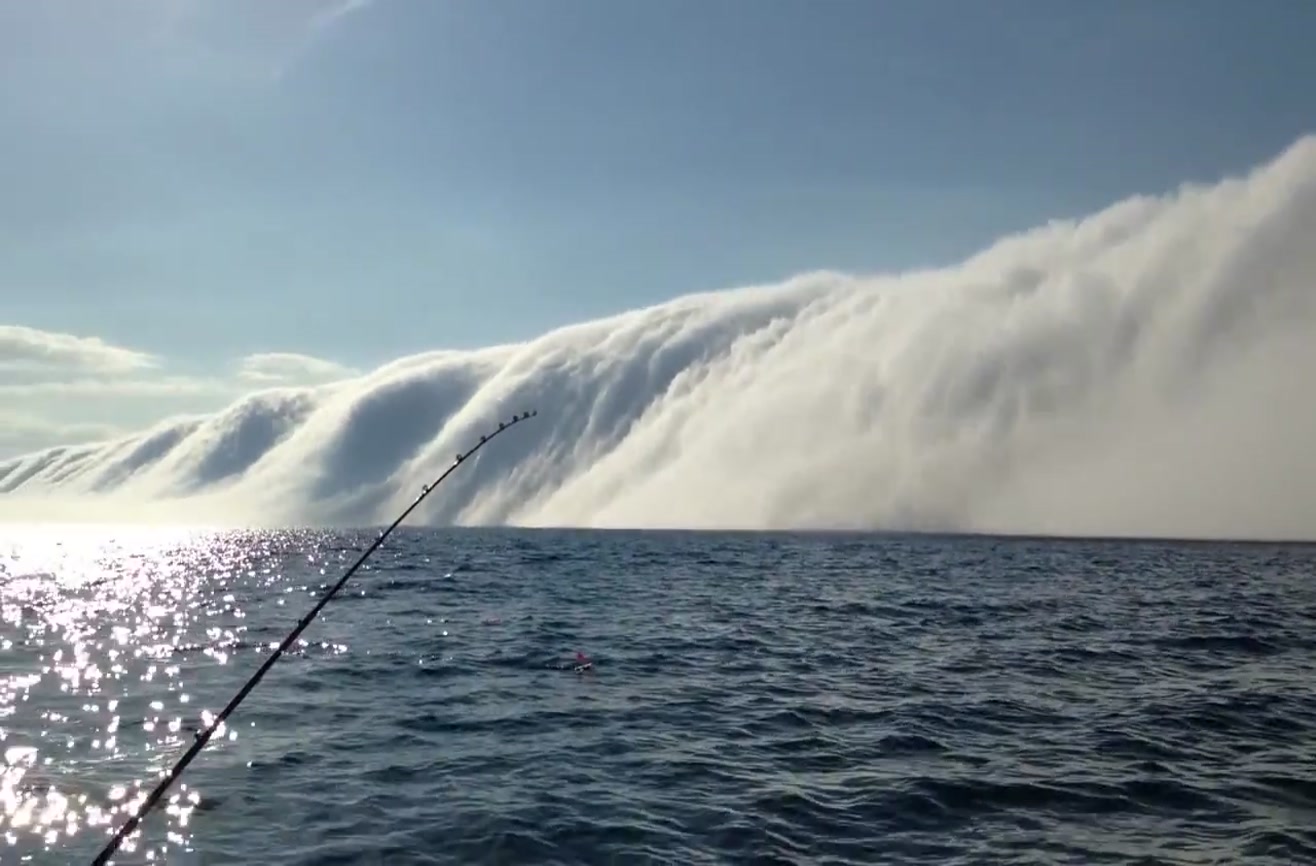 Huge fog bank rolls in over Lake Michigan.