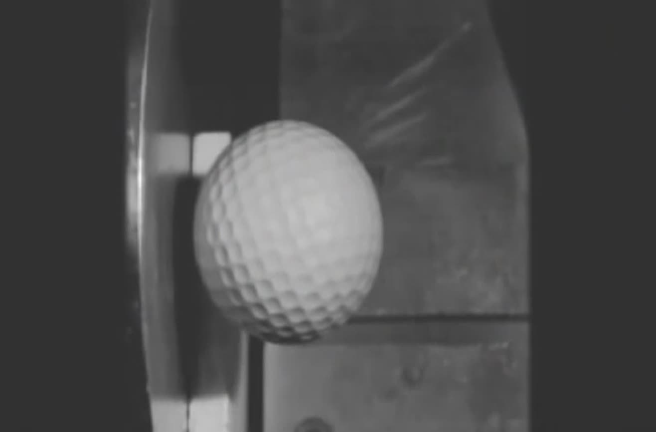 Golf ball hits a steel plate at 150 mph.