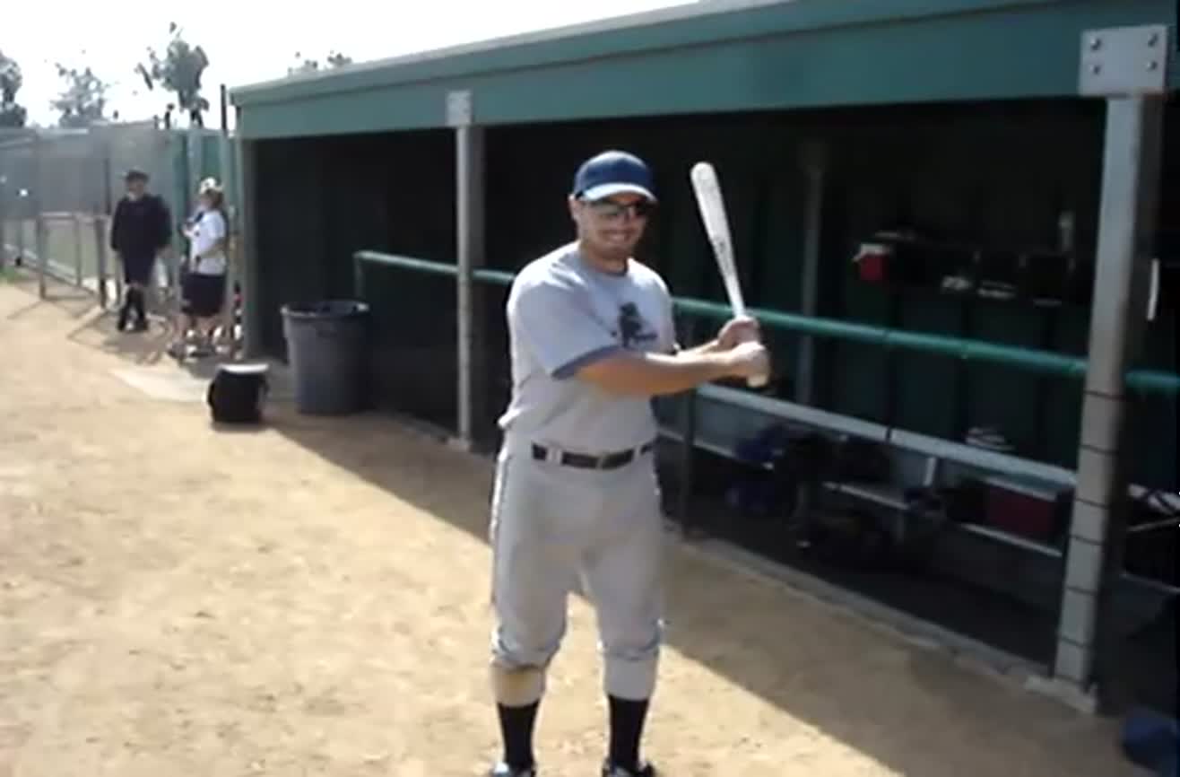 Spinning baseball bat trick.