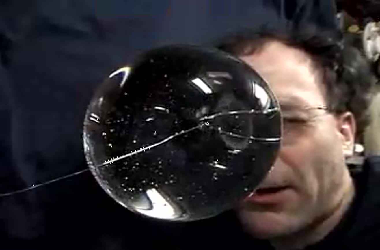 Waves in a free sphere of water. Very trippy.