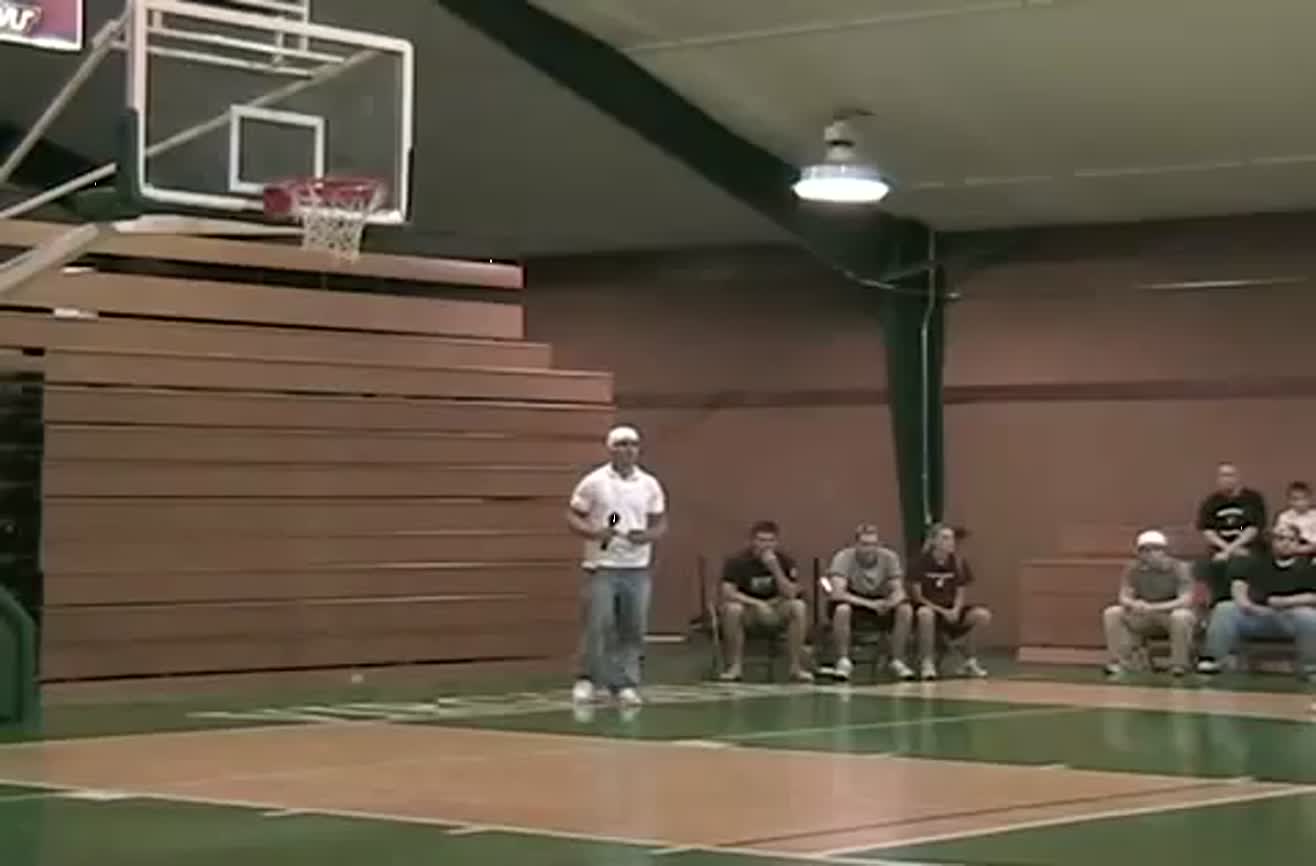 Overconfident dunk gets dude stuck in basketball rim.