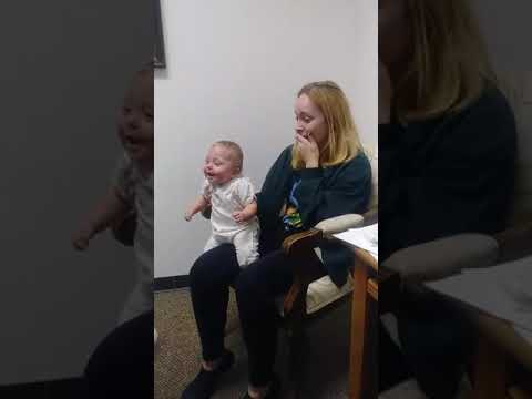 Baby hears for the first time and breaks out into fit of laughter