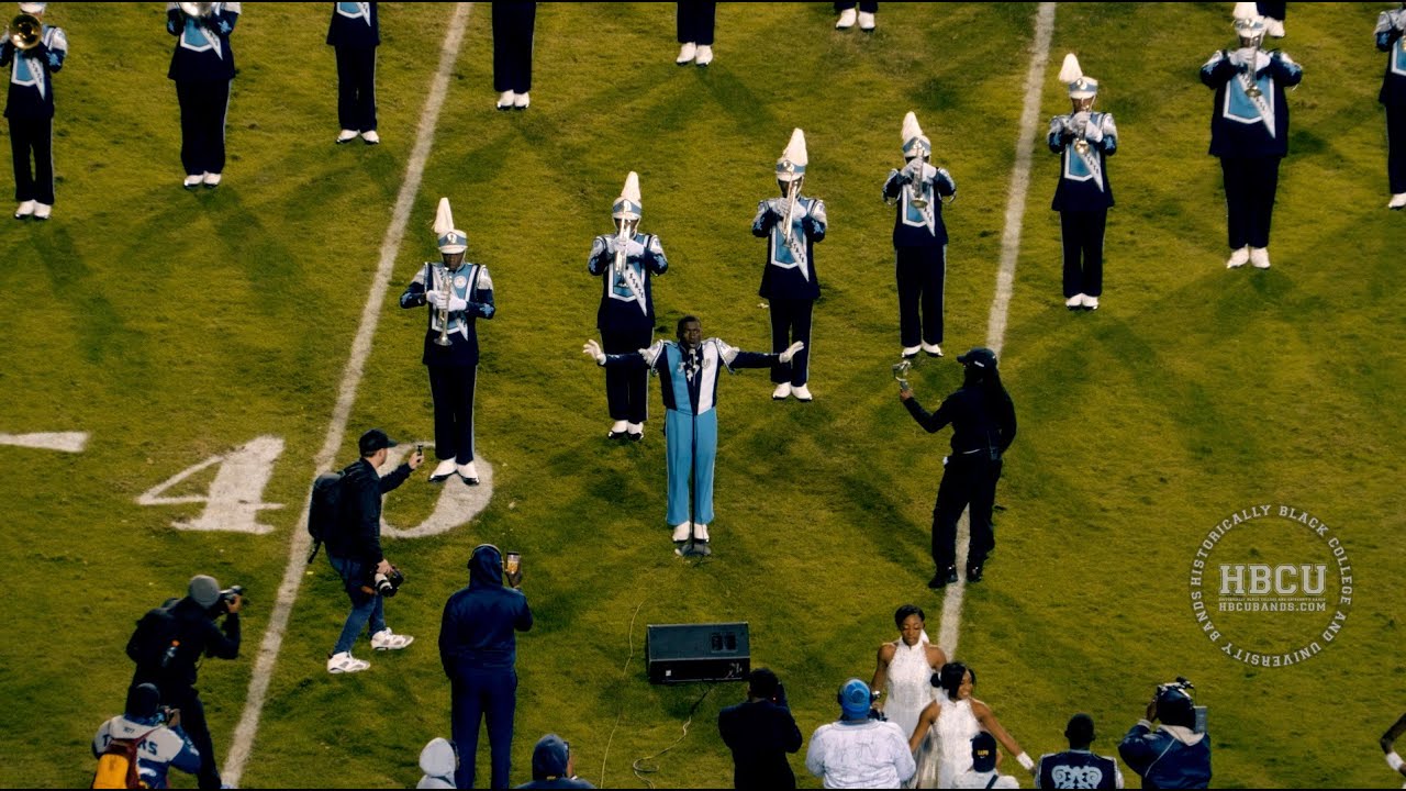 Drum major wows crowd by singing gospel.