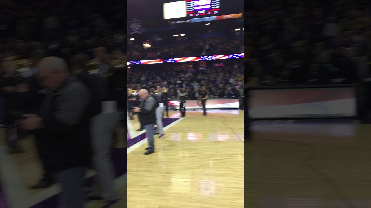 College trombone choir performs national anthem.