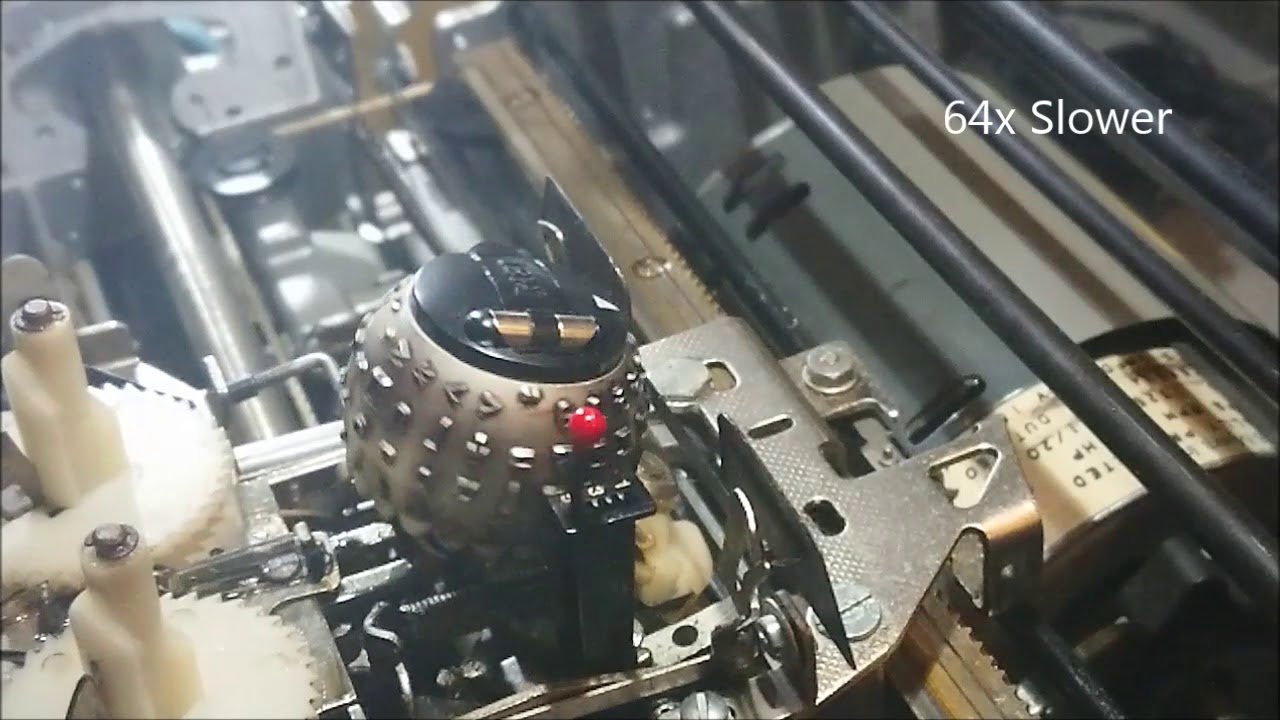 Typewriter golf ball in slow motion.