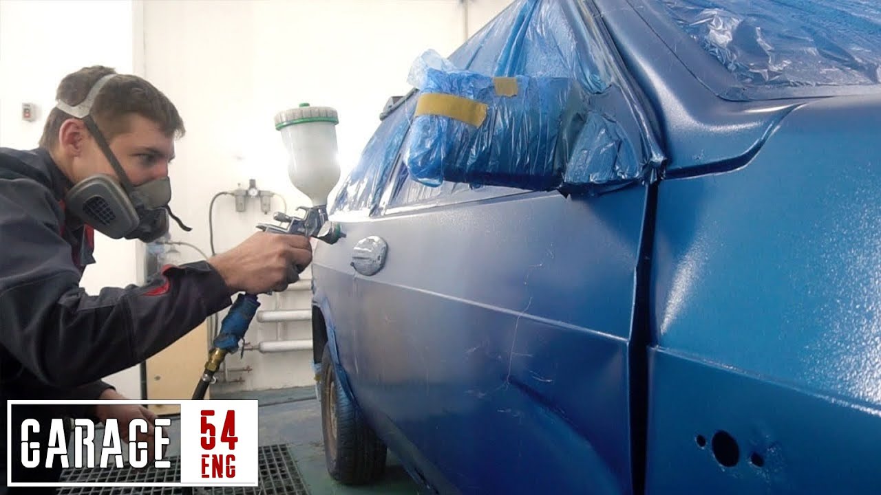 Spraying a car with liquid Styrofoam.