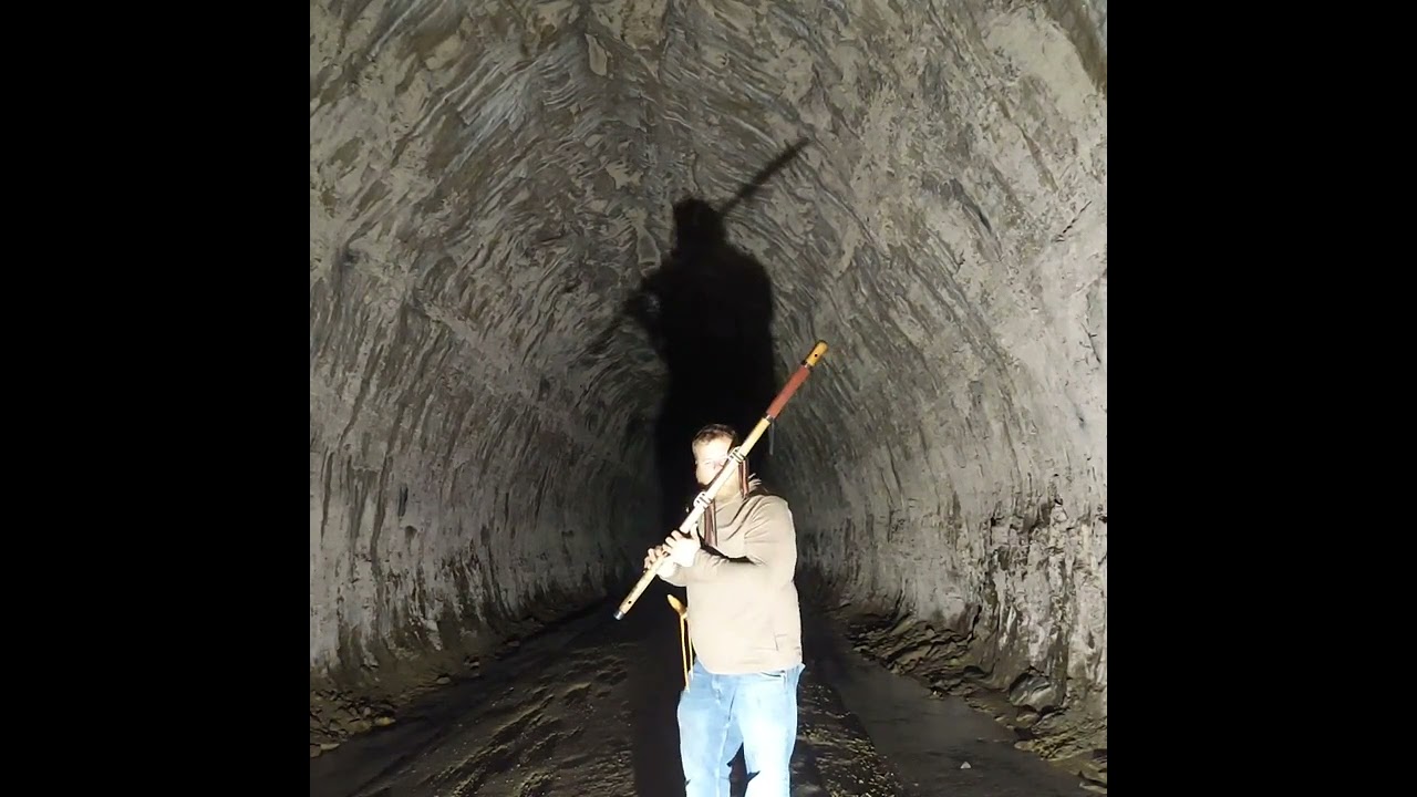 Flute guy plays 'Lord of the Rings' in milelong tunnel.