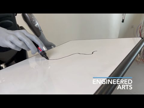 Ameca the robot draws a cat