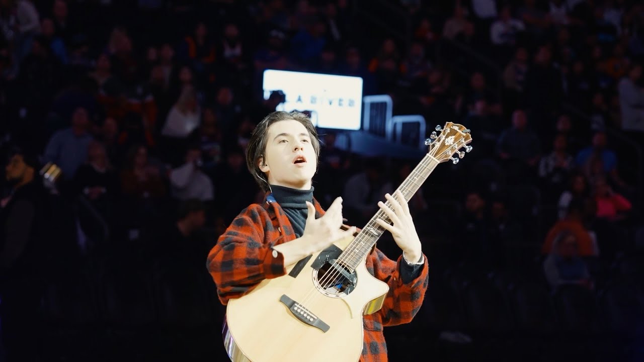 Solo guitarist performs during NBA Halftime Show.