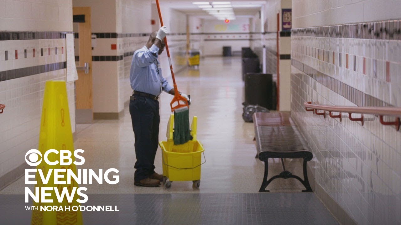 High school students surprise janitor with SUV.